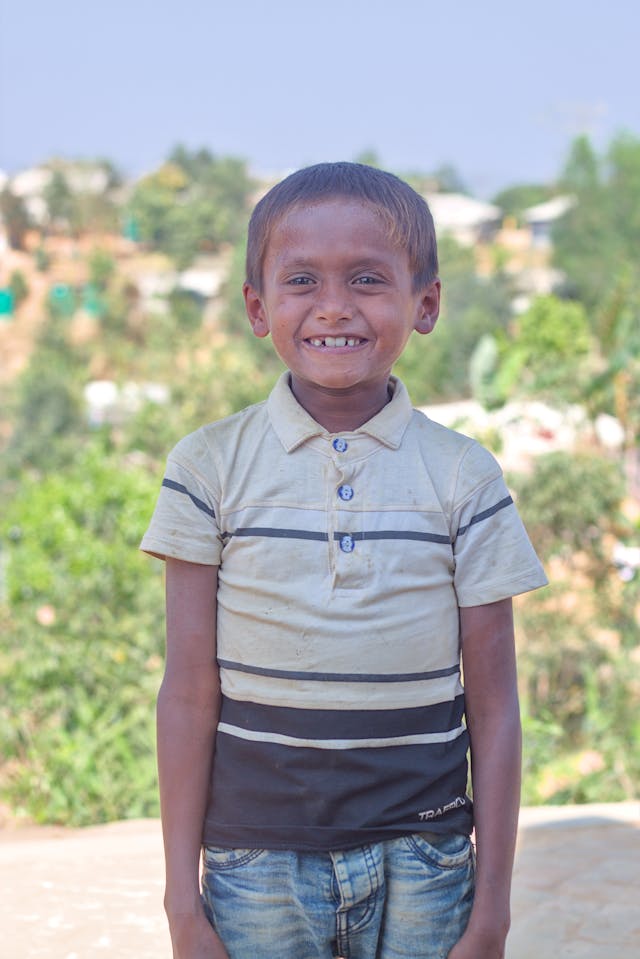 A child plays in the sunshine, enjoying a carefree moment of childhood